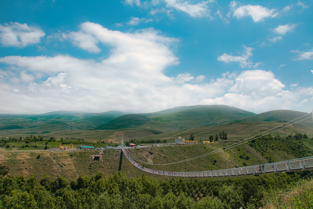 a view of a bridge in the middle of a valley