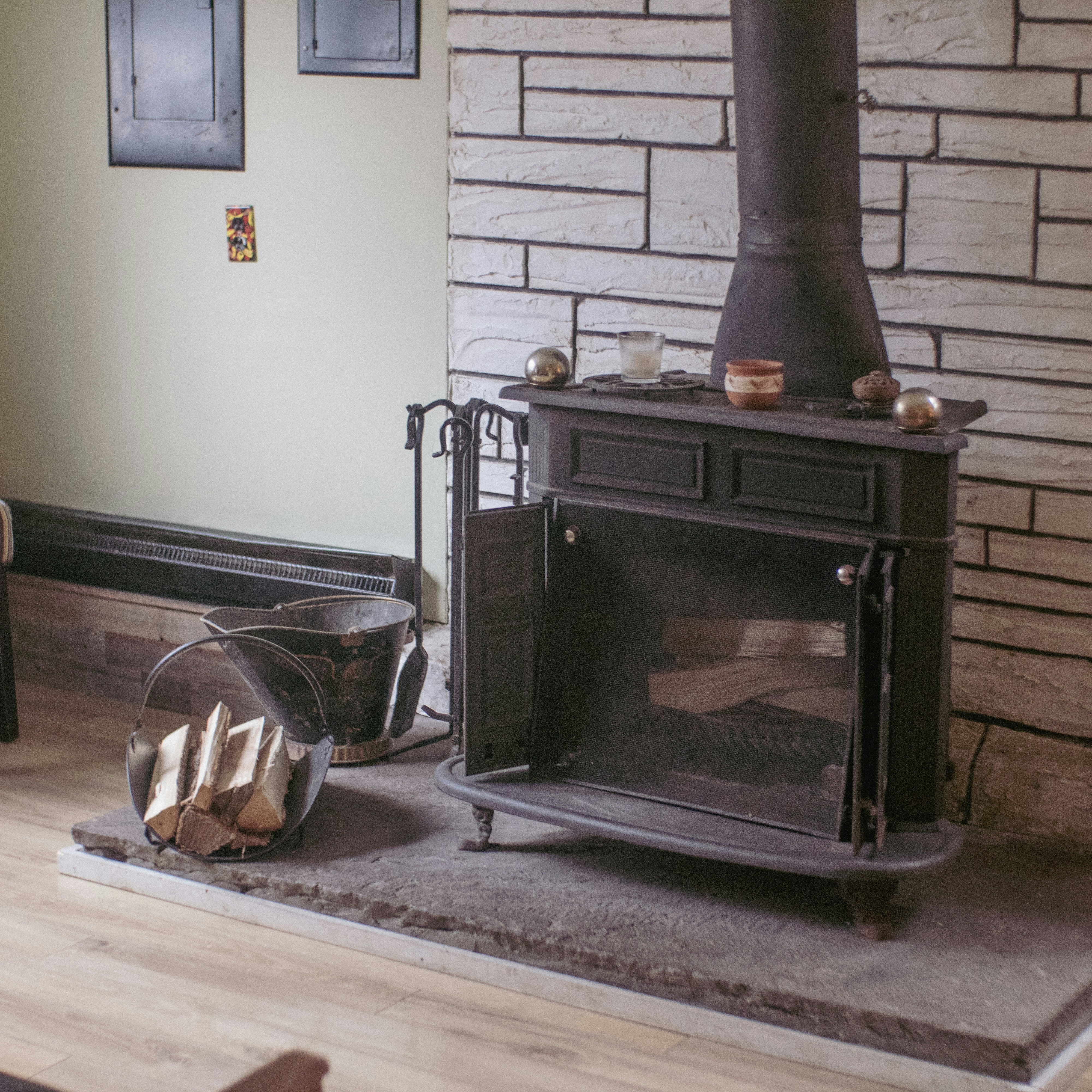 a living room with a fireplace and a fire place