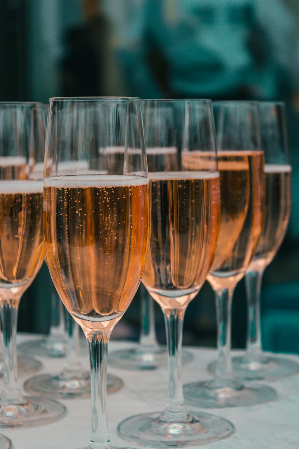 a row of wine glasses sitting on top of a table