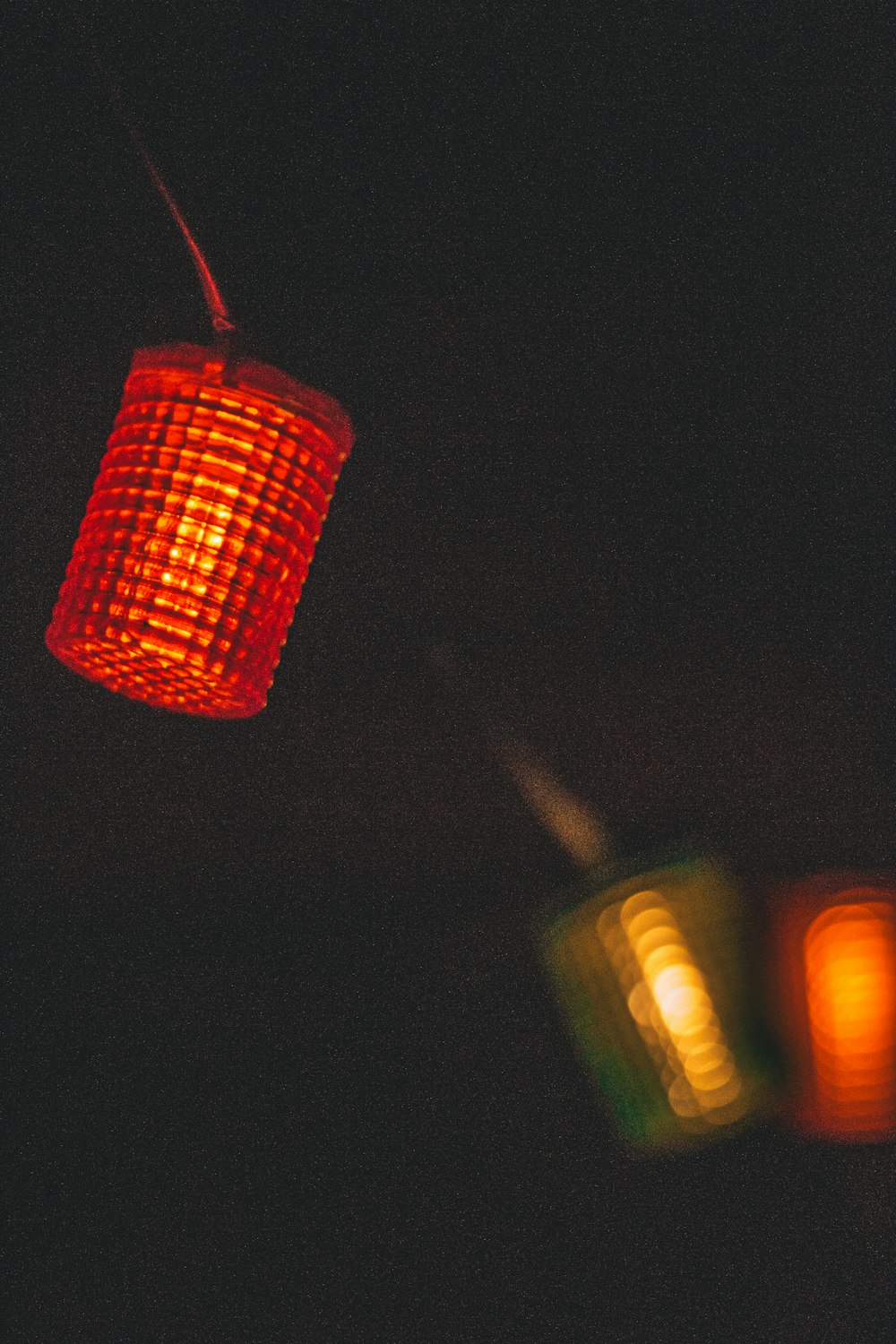 a close up of a traffic light in the dark