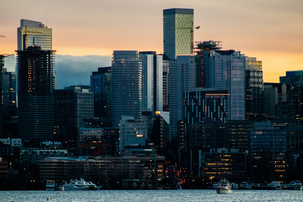 a city skyline with a boat in the water