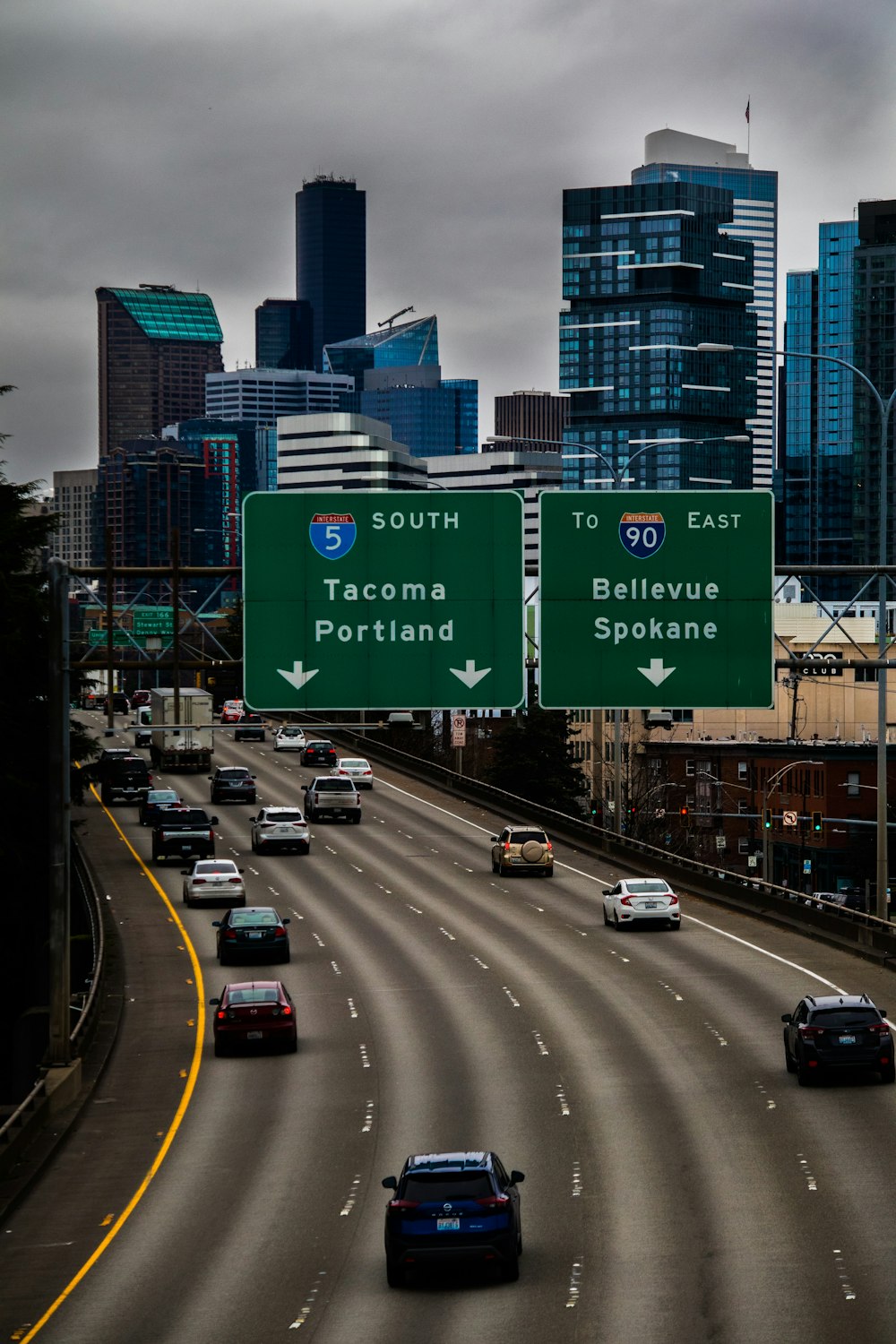 a highway with a bunch of cars driving down it