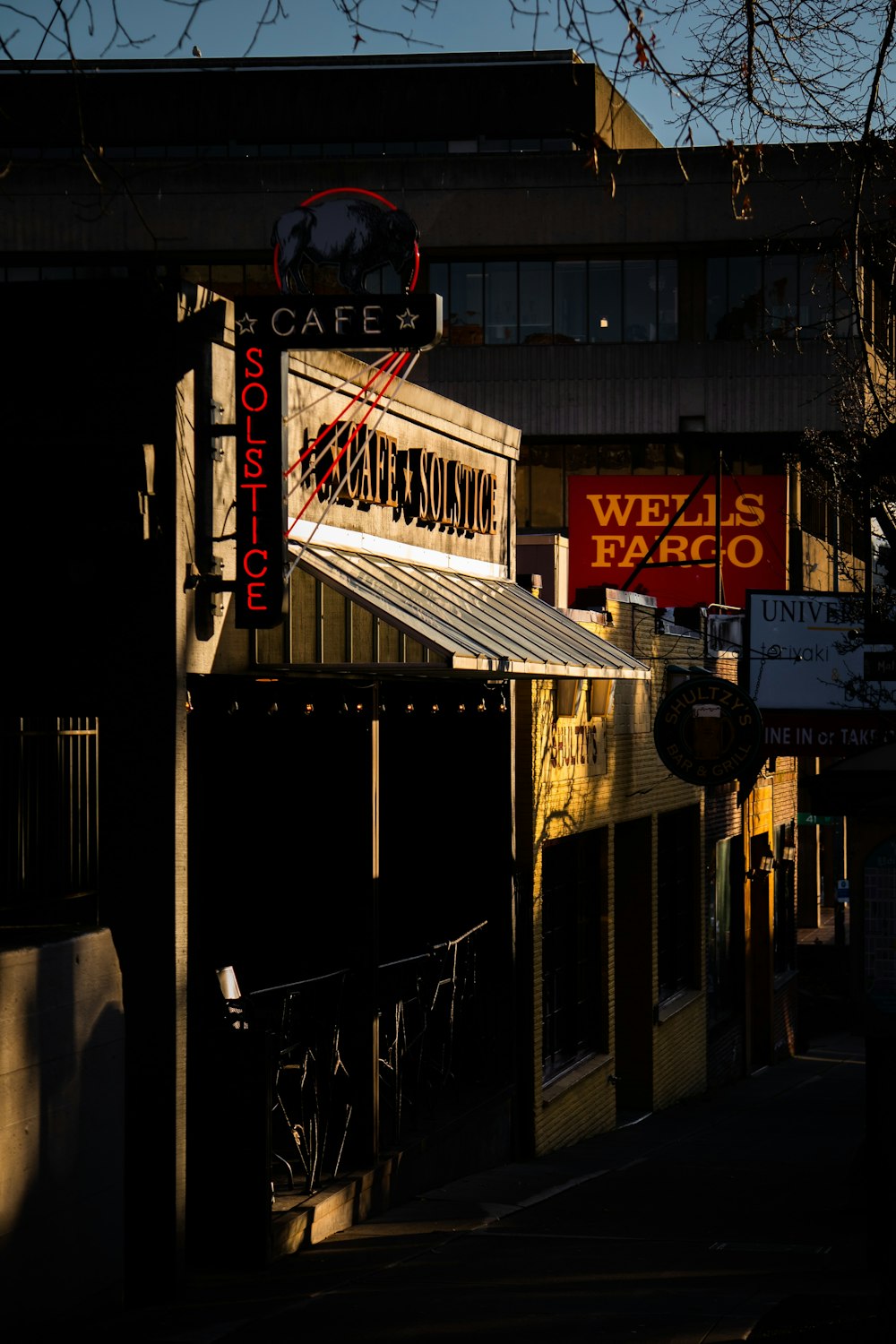 a building with a neon sign on the side of it