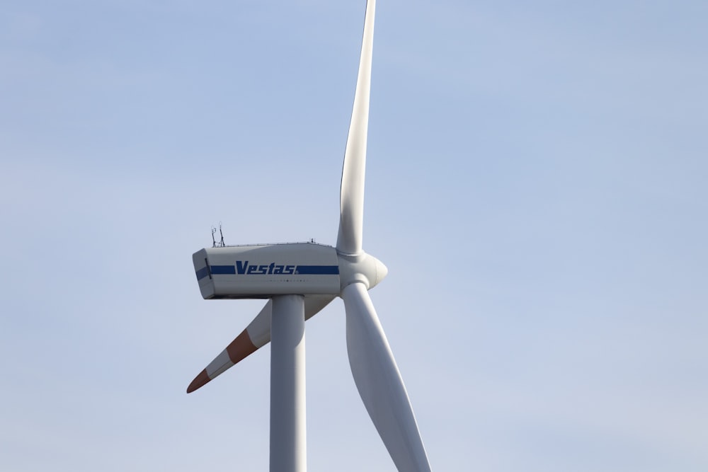 a wind turbine is shown against a blue sky