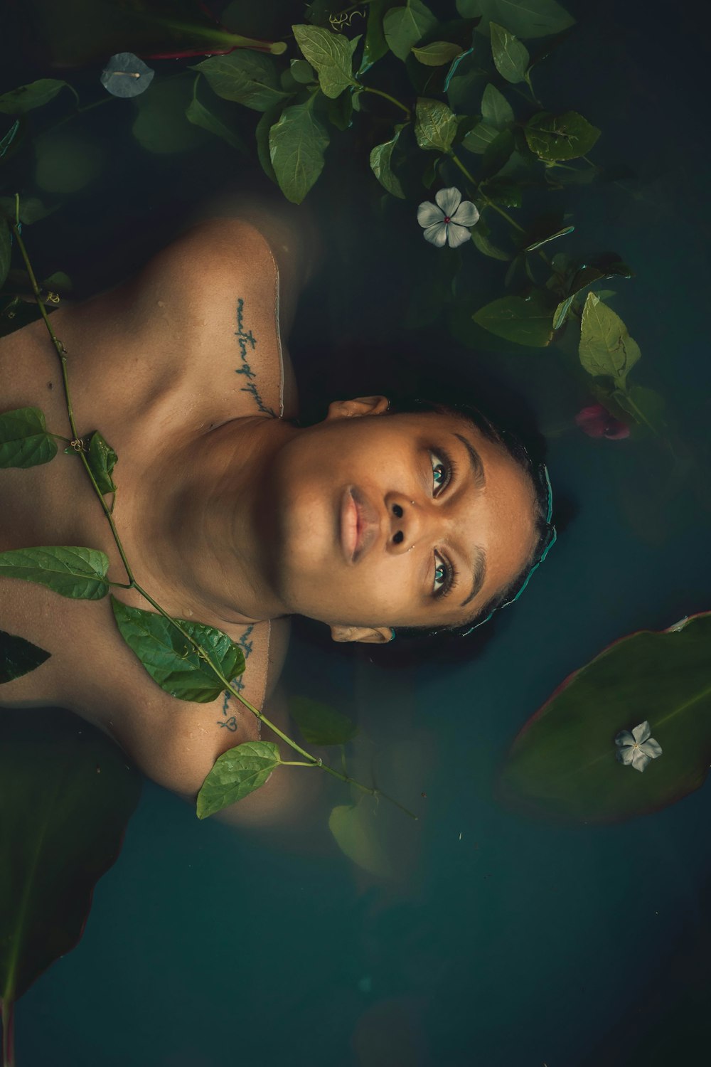 a woman is floating in a pool of water