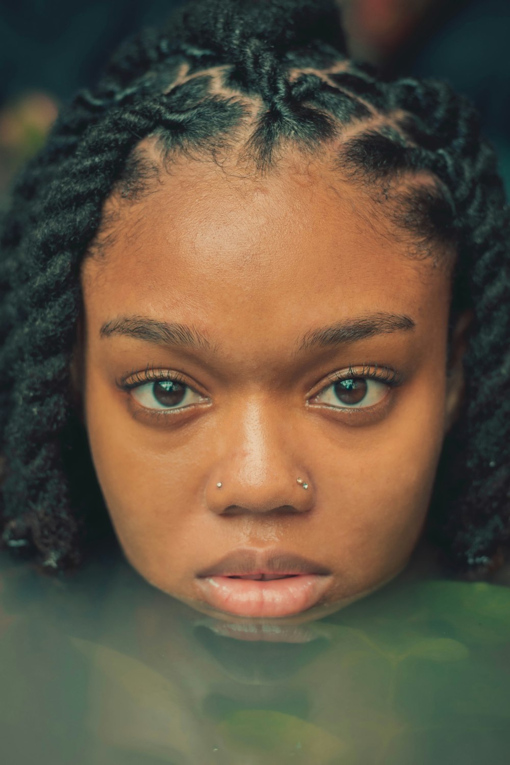 a close up of a person with dreadlocks