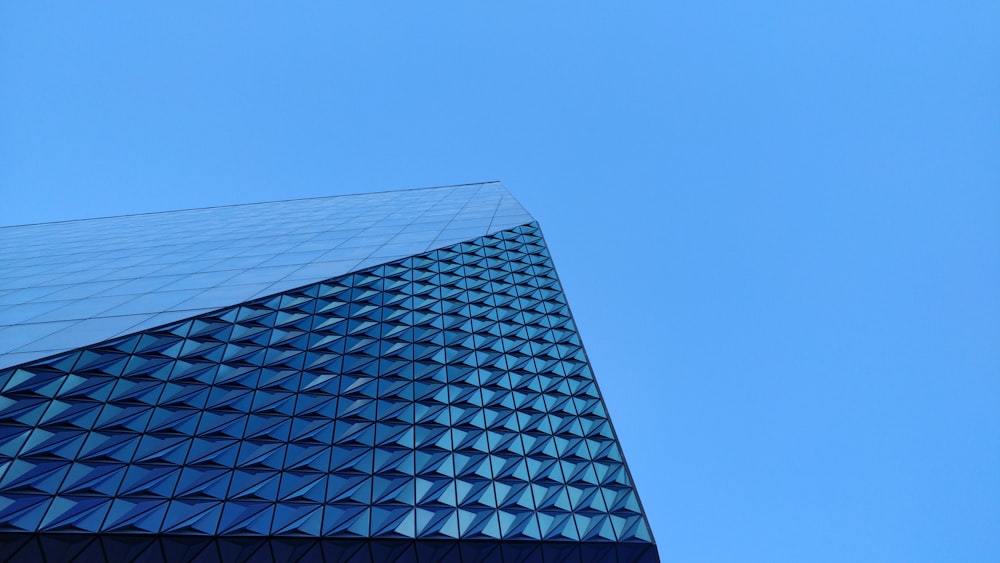 a very tall building with a sky background