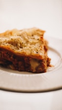 a piece of lasagna on a white plate