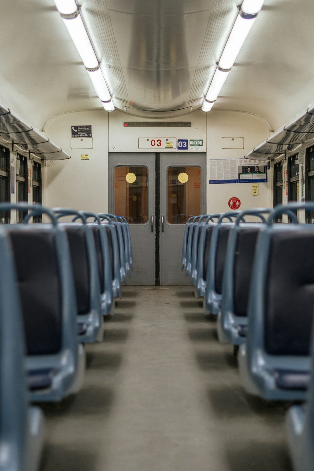 a view of the inside of a train with empty seats