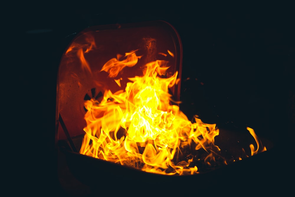 a close up of a fire in a container