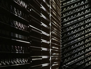 A secure server room with rows of servers and blinking lights.