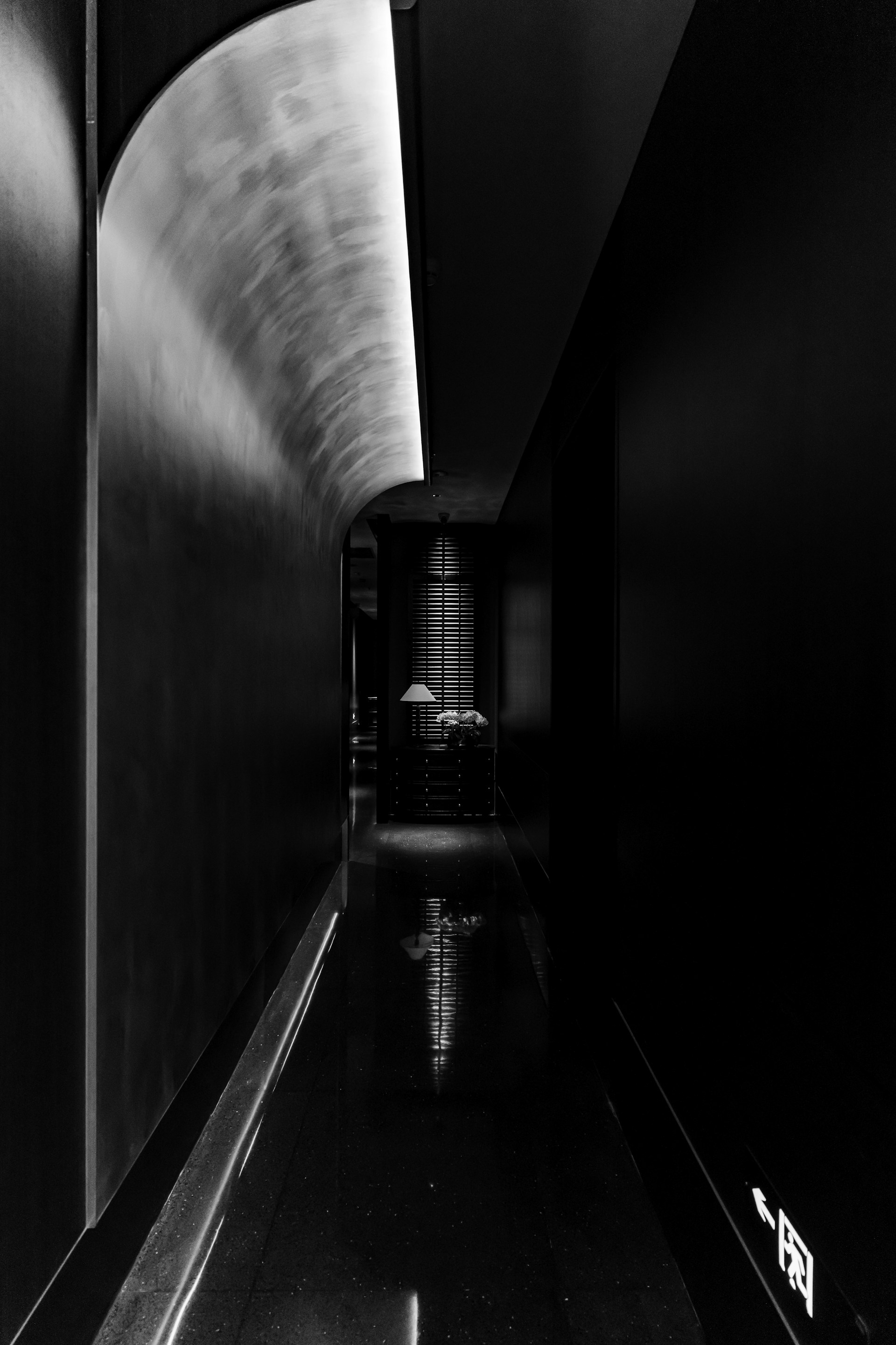 a black and white photo of a hallway