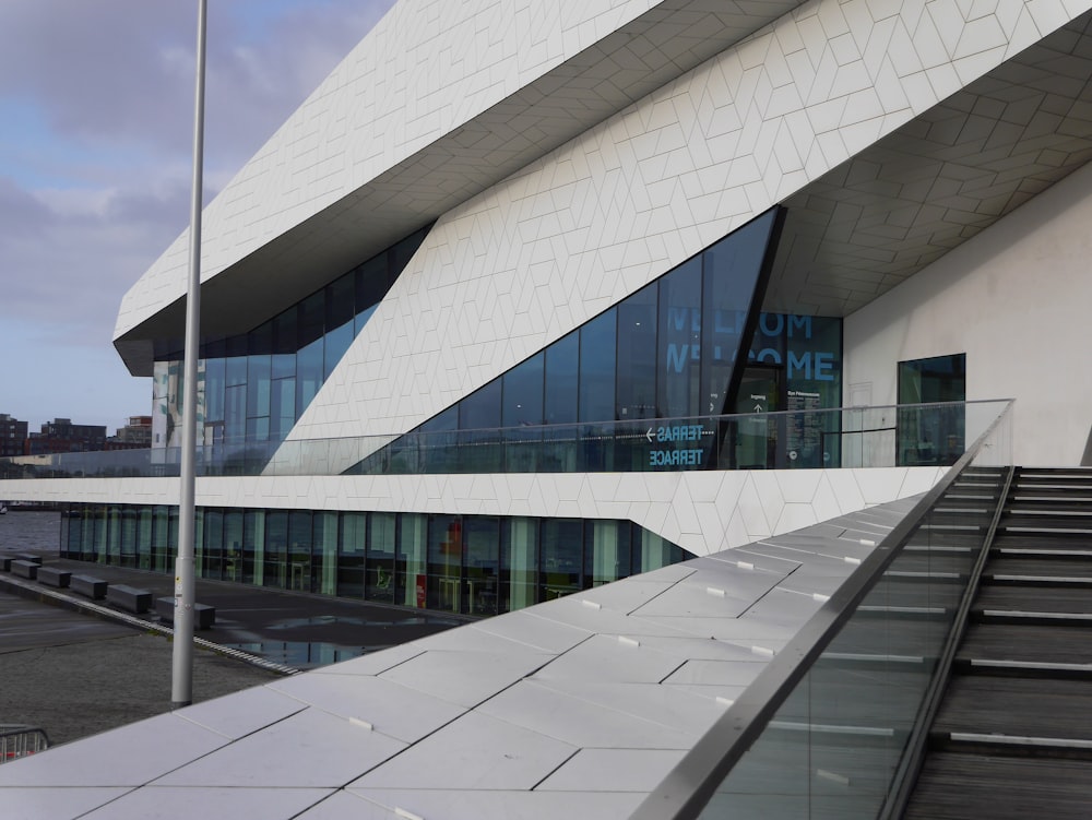 a white building with a staircase leading up to it