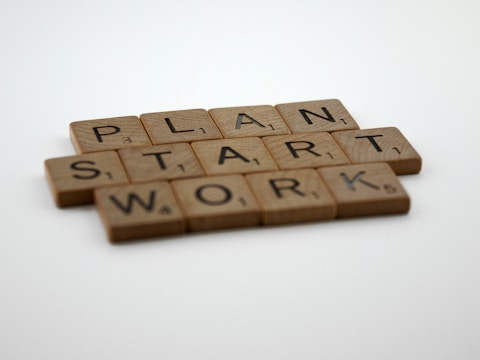 scrabble tiles spelling plan, start, and work