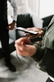 a person holding a cell phone in their hands