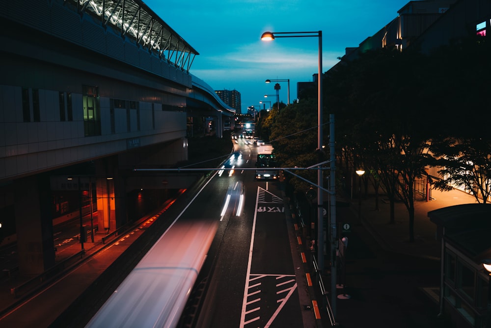 a city street filled with lots of traffic at night