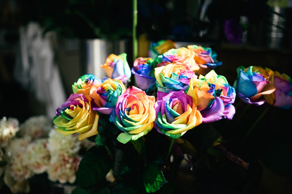 a bouquet of multicolored roses in a vase