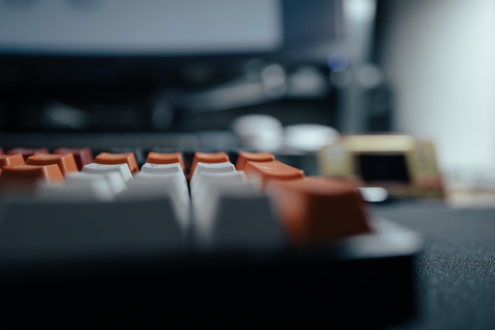 a close up of a computer keyboard with a blurry background