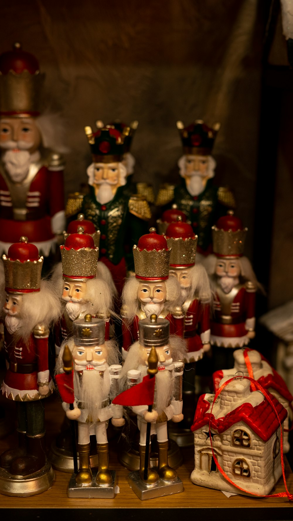 a group of nutcrackers sitting on top of a wooden table