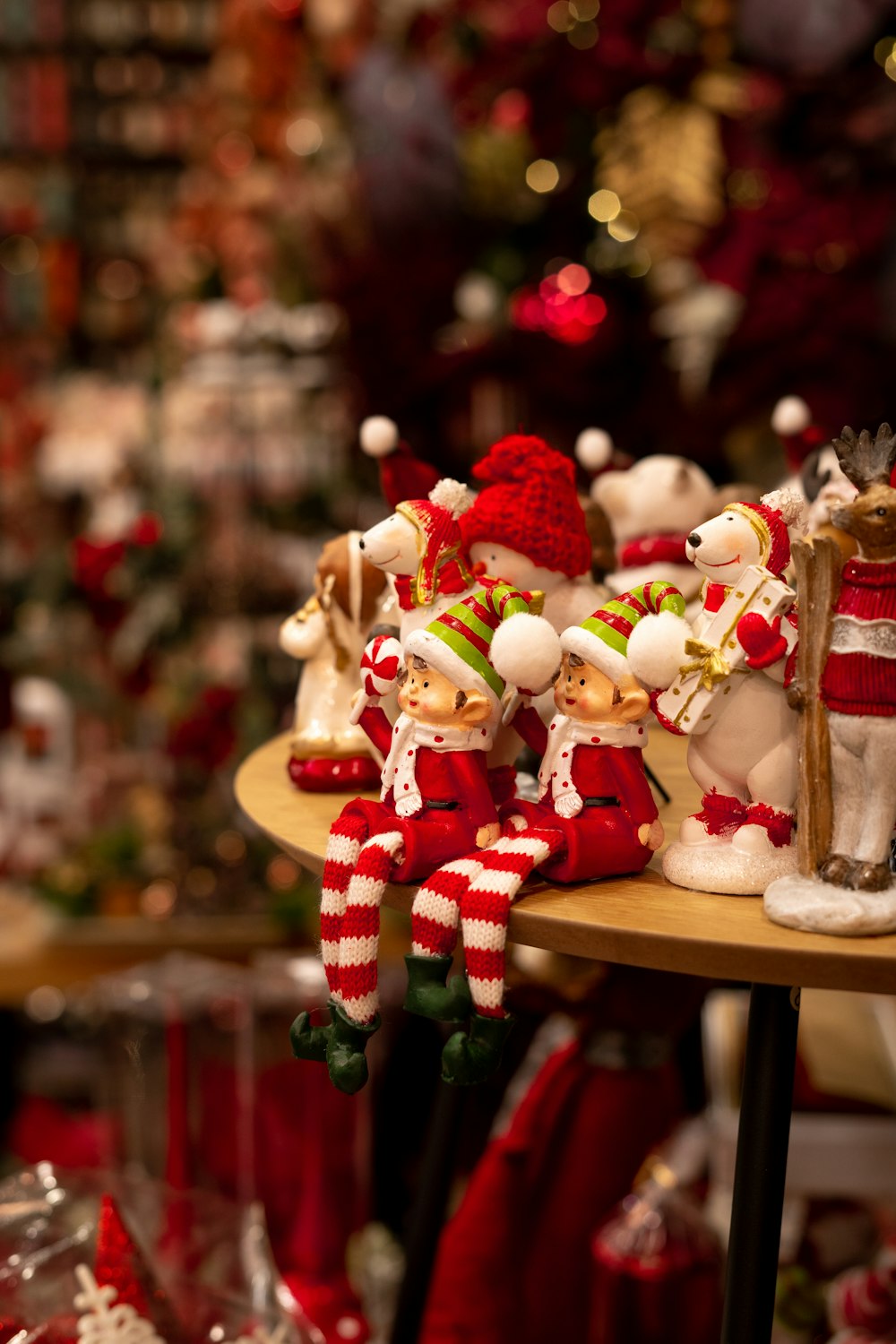 a group of christmas figurines sitting on top of a table