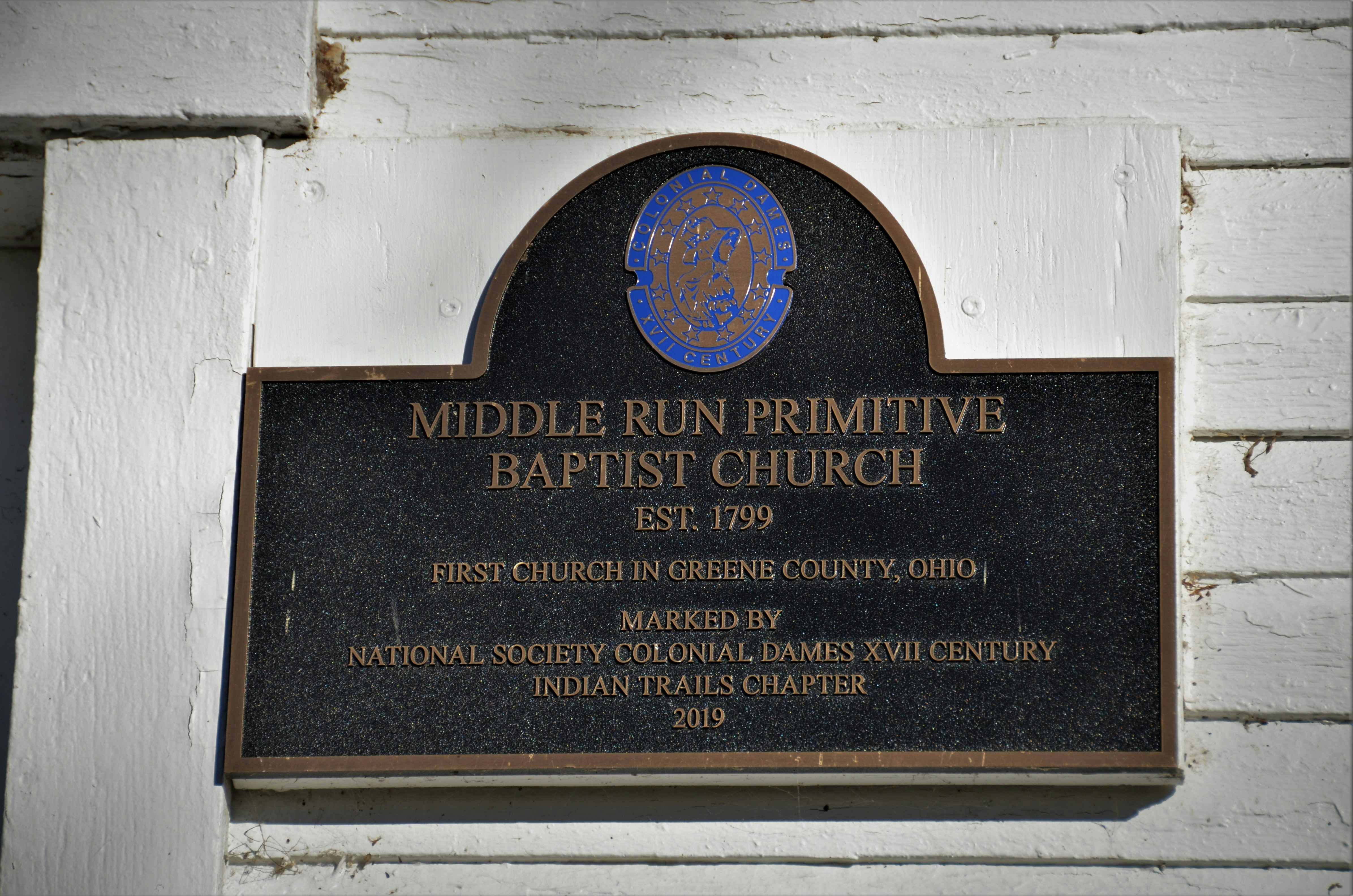 a plaque on the side of a building