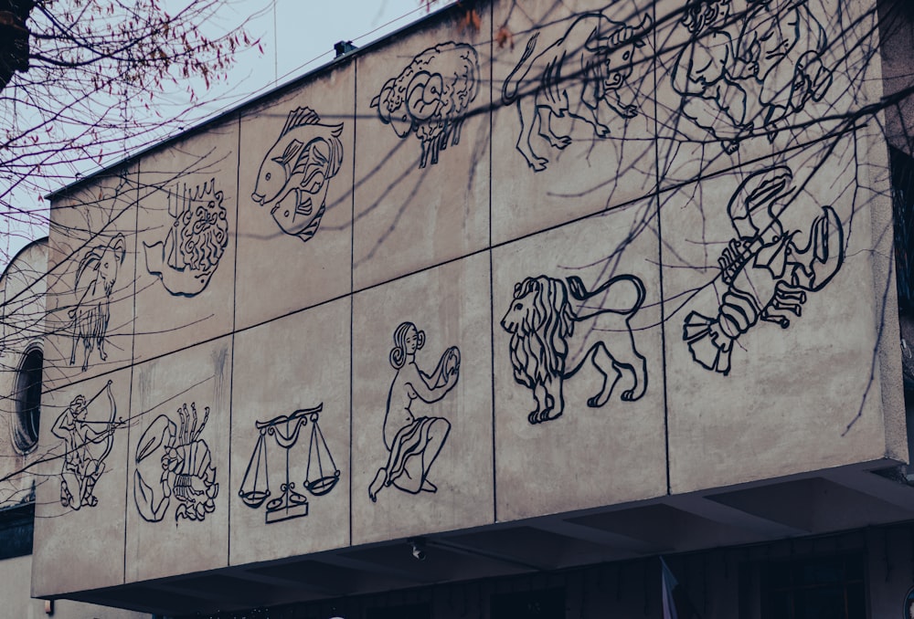 a building that has a bunch of drawings on it