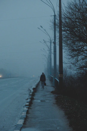 a group of people riding skis on a snowy street