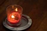 A lit stone candle vessel creating a cozy ambiance.