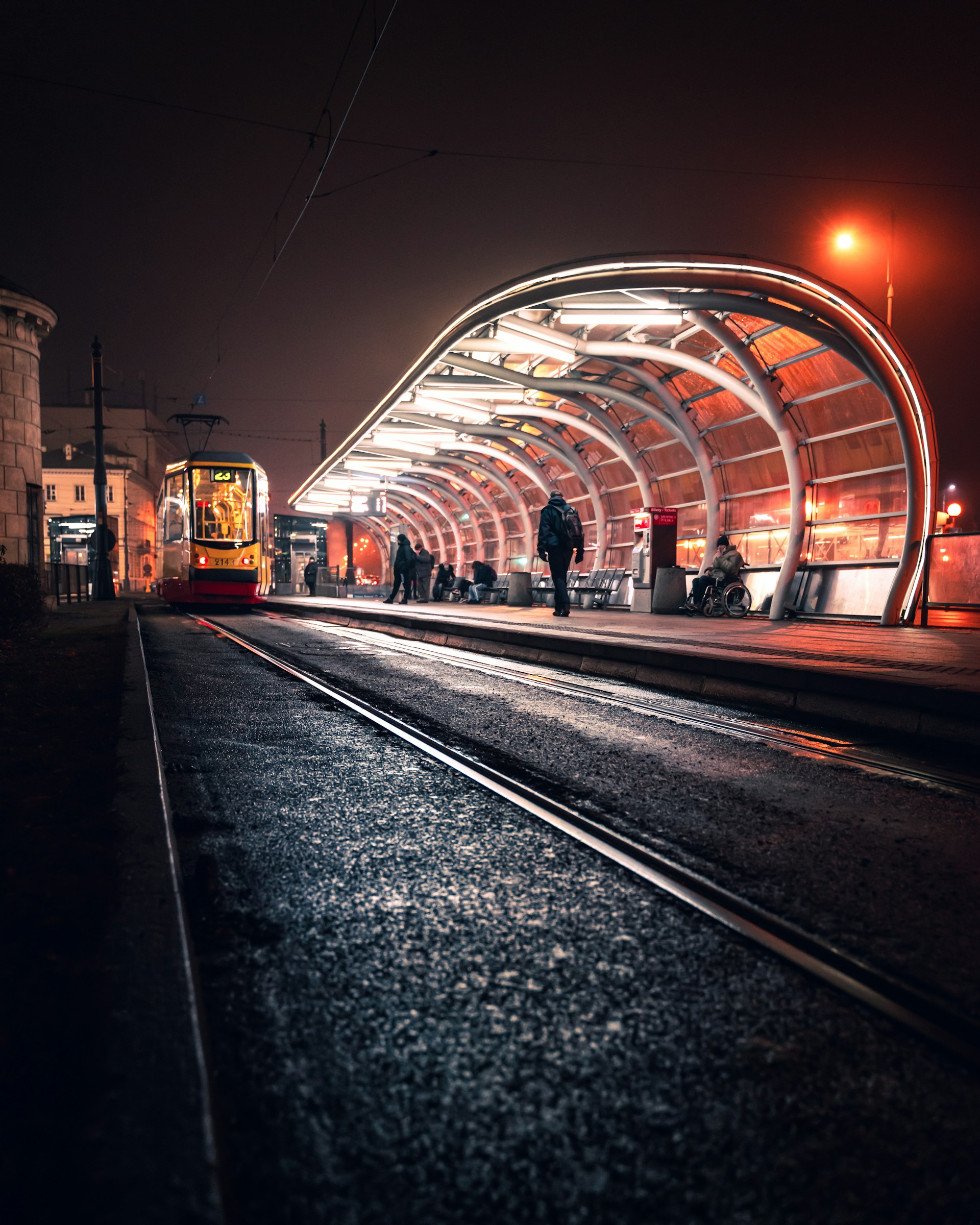 a train station with a train on the tracks