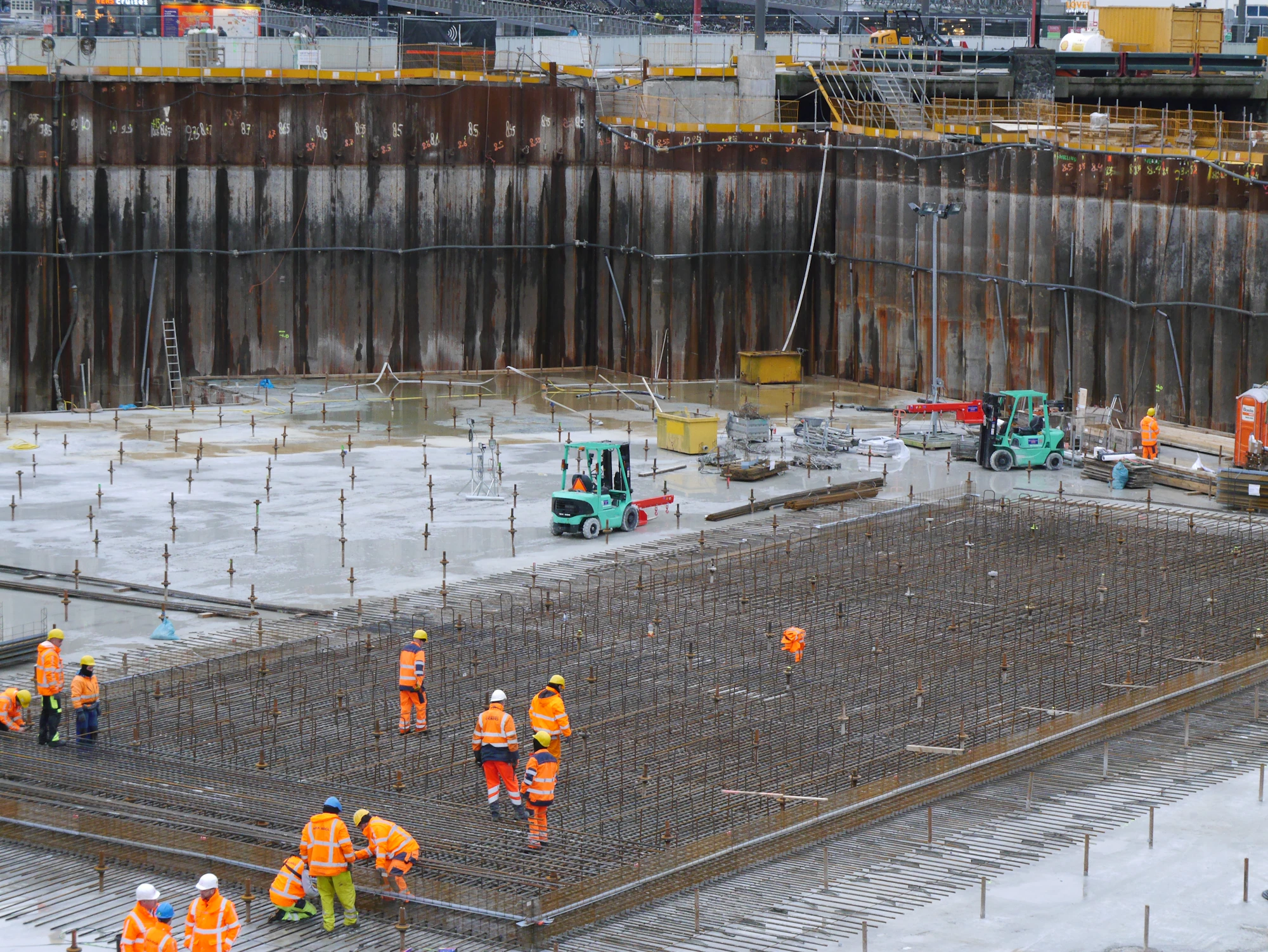 Construction workers around a large project site