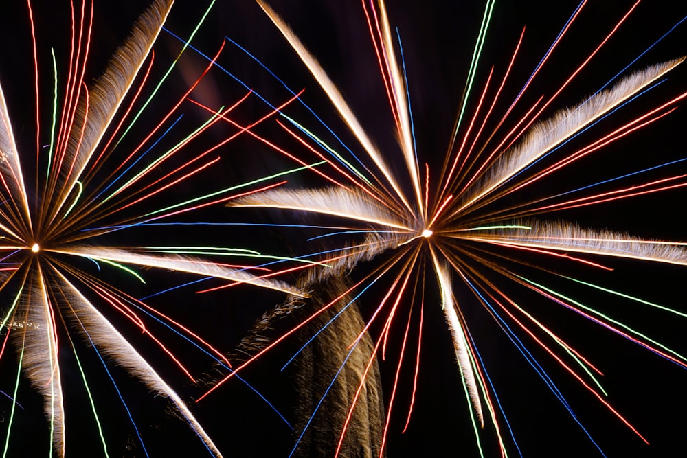 a colorful fireworks display in the night sky