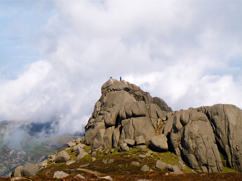 a large rock formation on top of a mountain