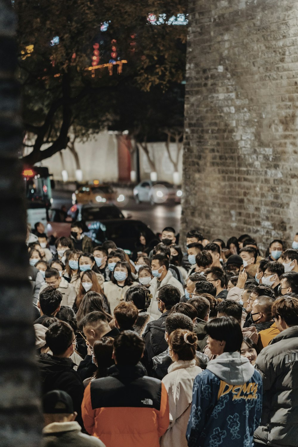 a crowd of people standing next to each other