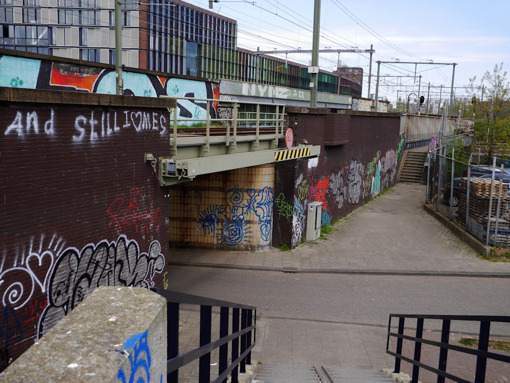 a street with graffiti on the side of it