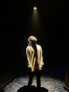 Danica sharing a heartfelt moment with the crowd, bathed in soft spotlight glow