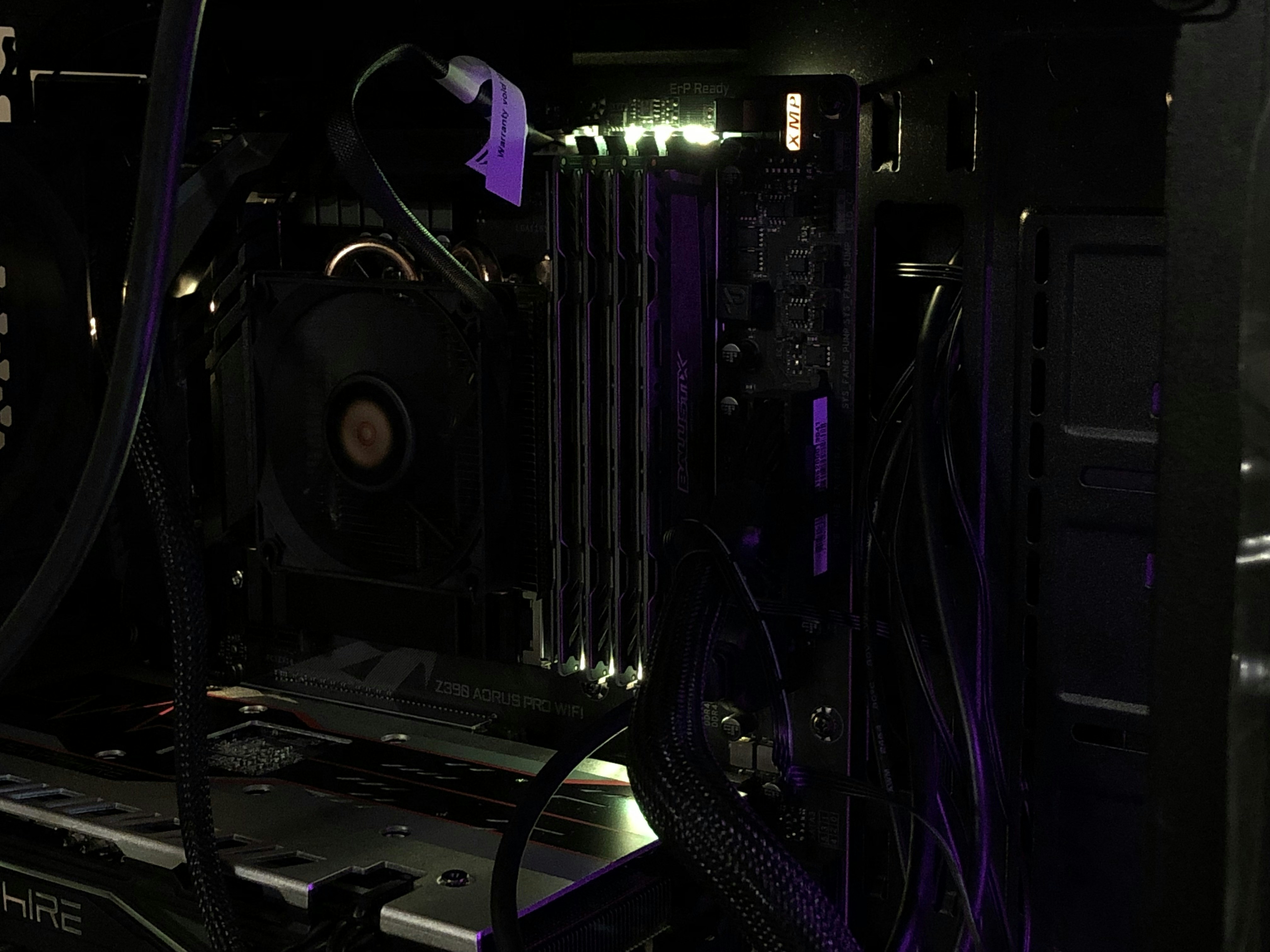 Computer components and parts on dark surface, low-key technical lighting