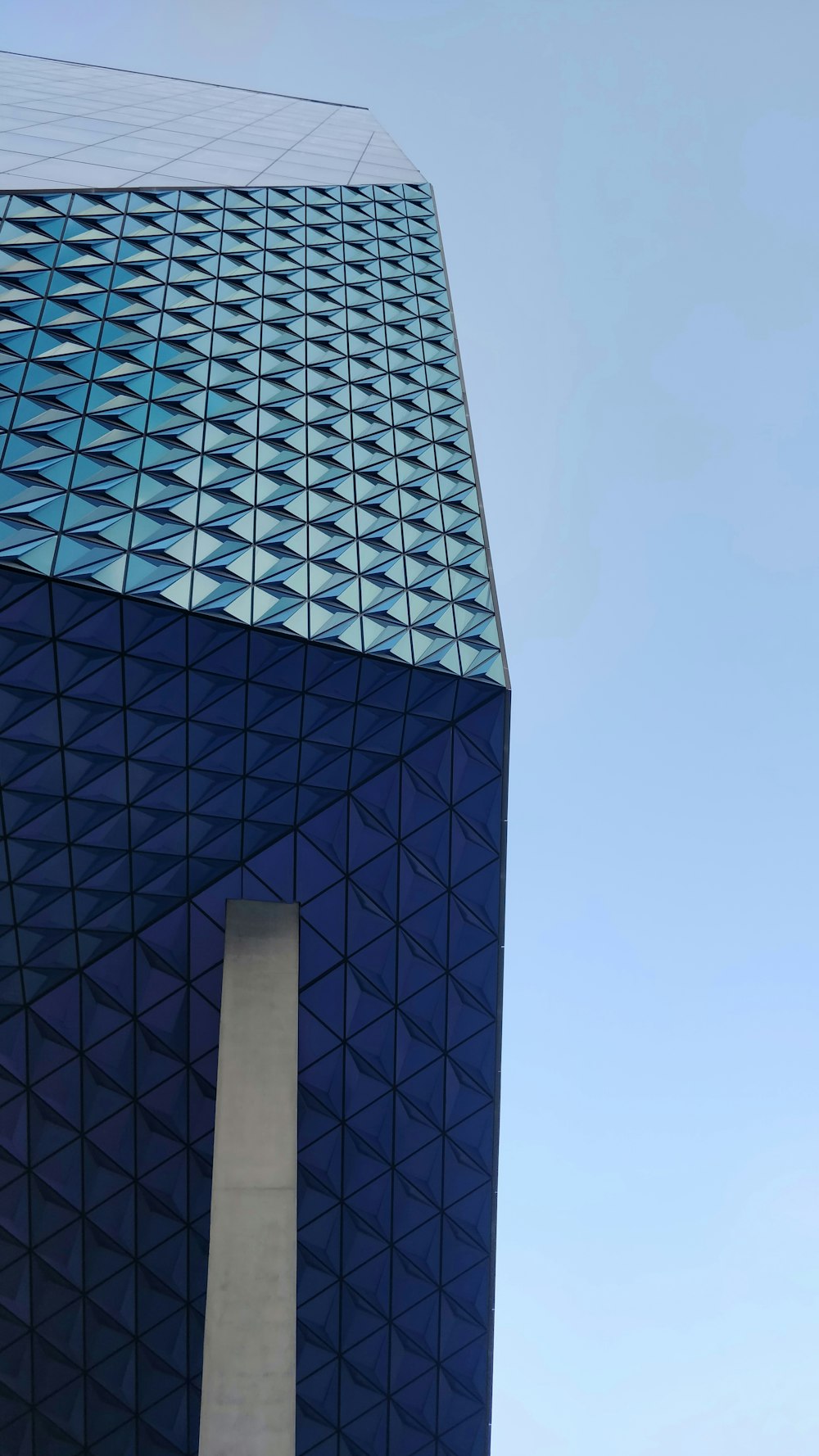 a very tall building with a sky background