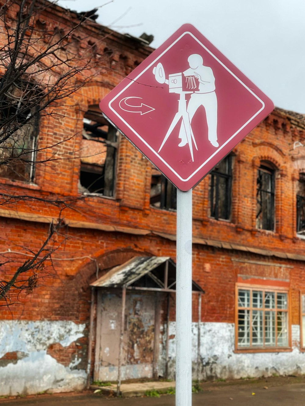 a street sign in front of an old building