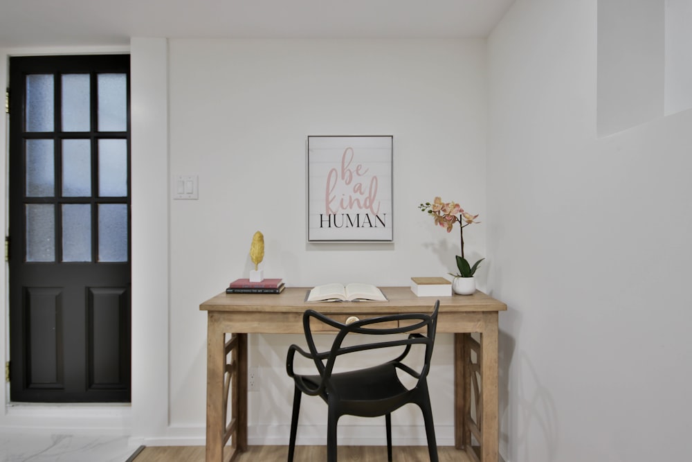 a desk with a chair and a book on it