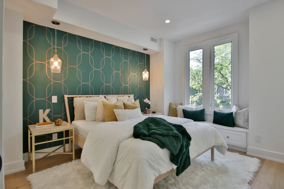 Bedroom with a deep green feature wall