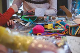 a colorful toy on a cutting board with a cake