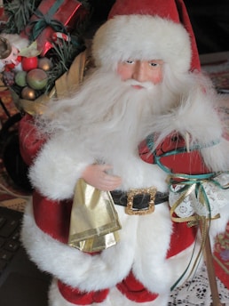 A cheerful Santa Claus avatar holding a handwritten letter with a festive background.