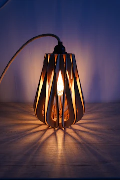 Handmade decorative lamp with warm light, made from wood and concrete.