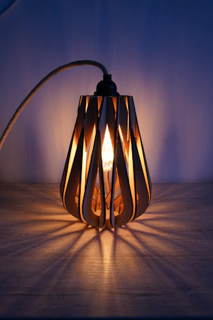 Elegant 3D printed decorative lamp casting warm light in a cozy living room.