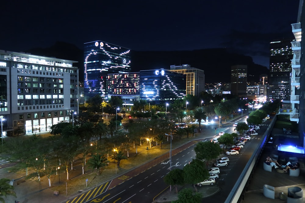 a city at night with a lot of traffic