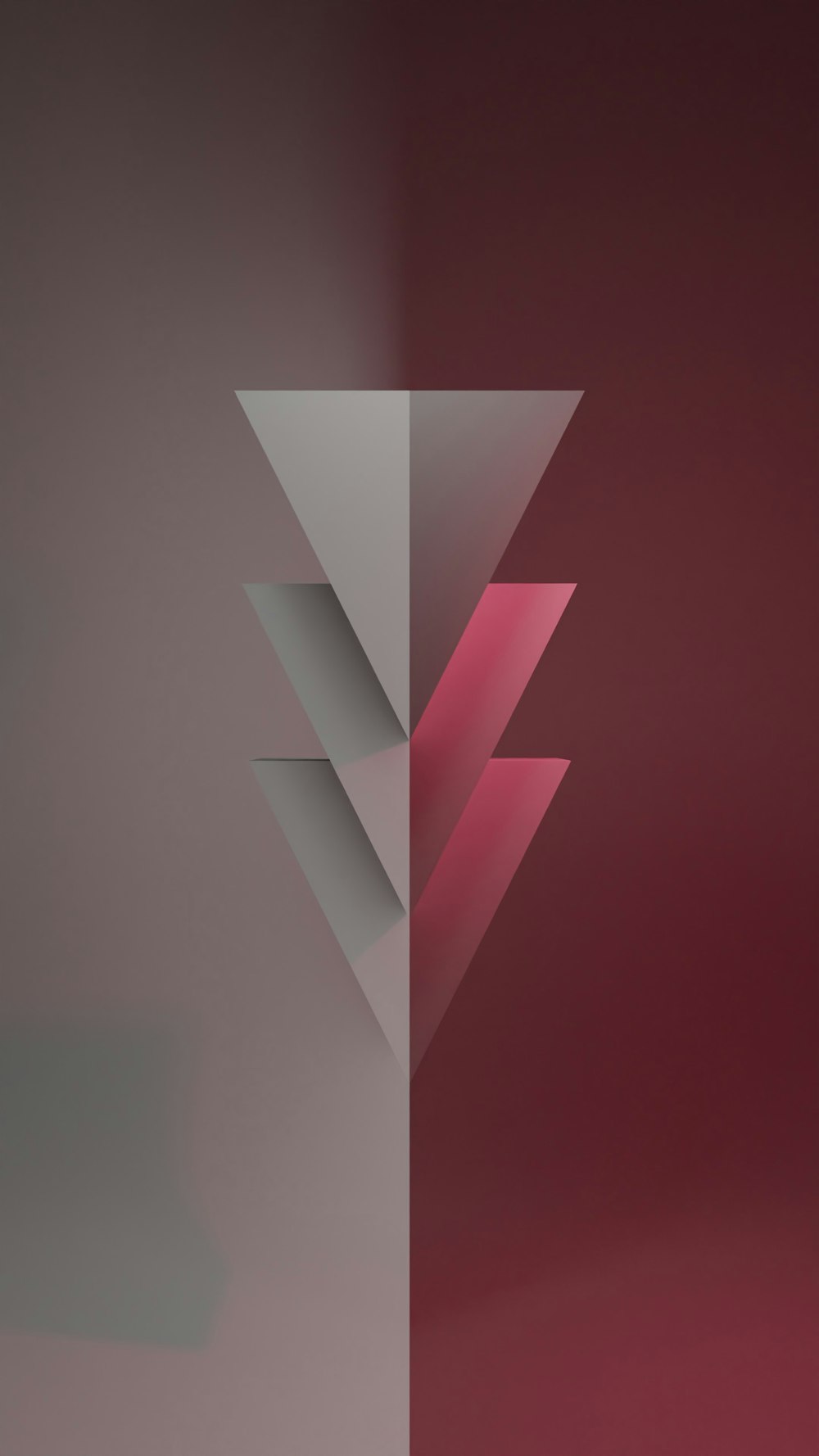 a red and grey background with a white triangle