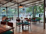 A restaurant with green cushions