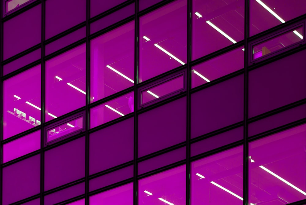 a purple building with lots of windows lit up