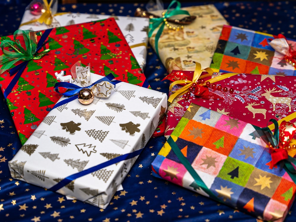 a group of wrapped presents sitting on top of a table