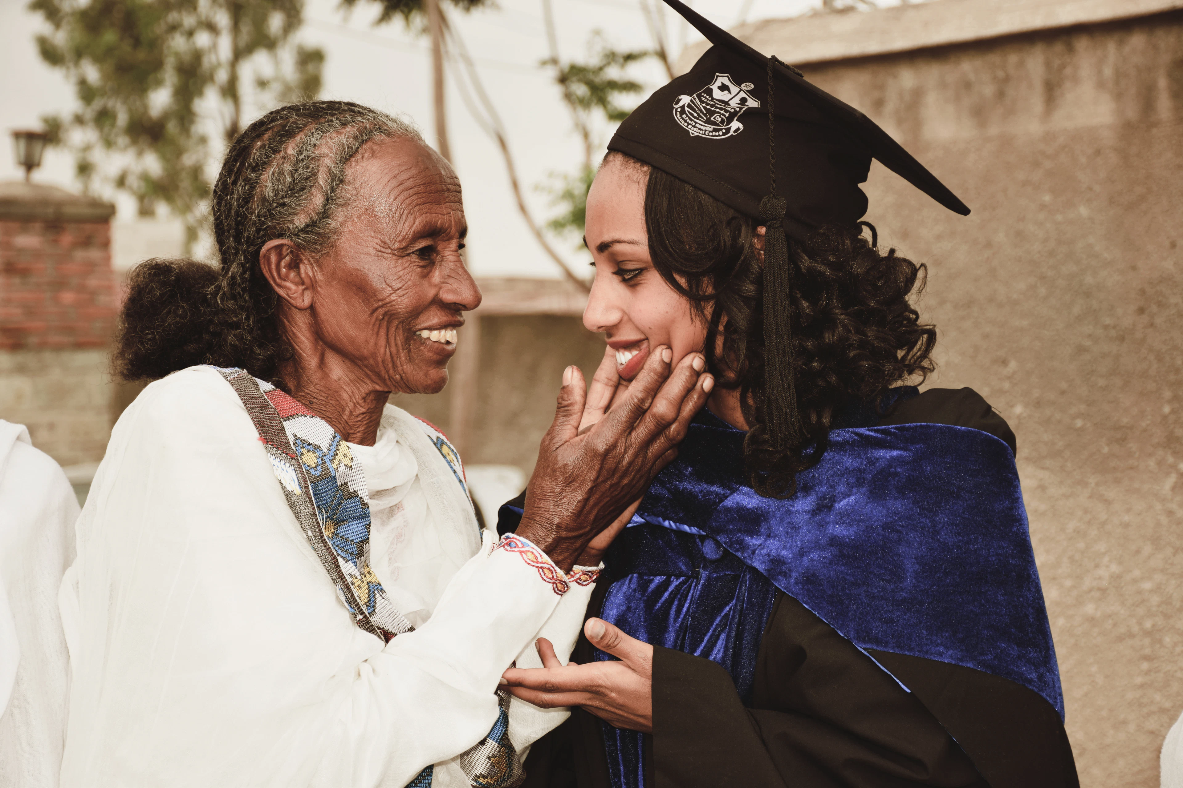 A grandmother congratulating her granddaughter